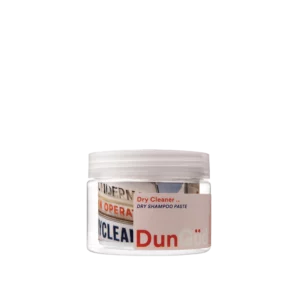Transparant potje DunGüd Concrete Jungle Dry Shampoo Paste met witte draaiende deksel en kleurrijk etiket.