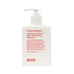 Witte fles evo Ritual Salvation repairing conditioner van 300 ml met rode tekst en pompdispenser.