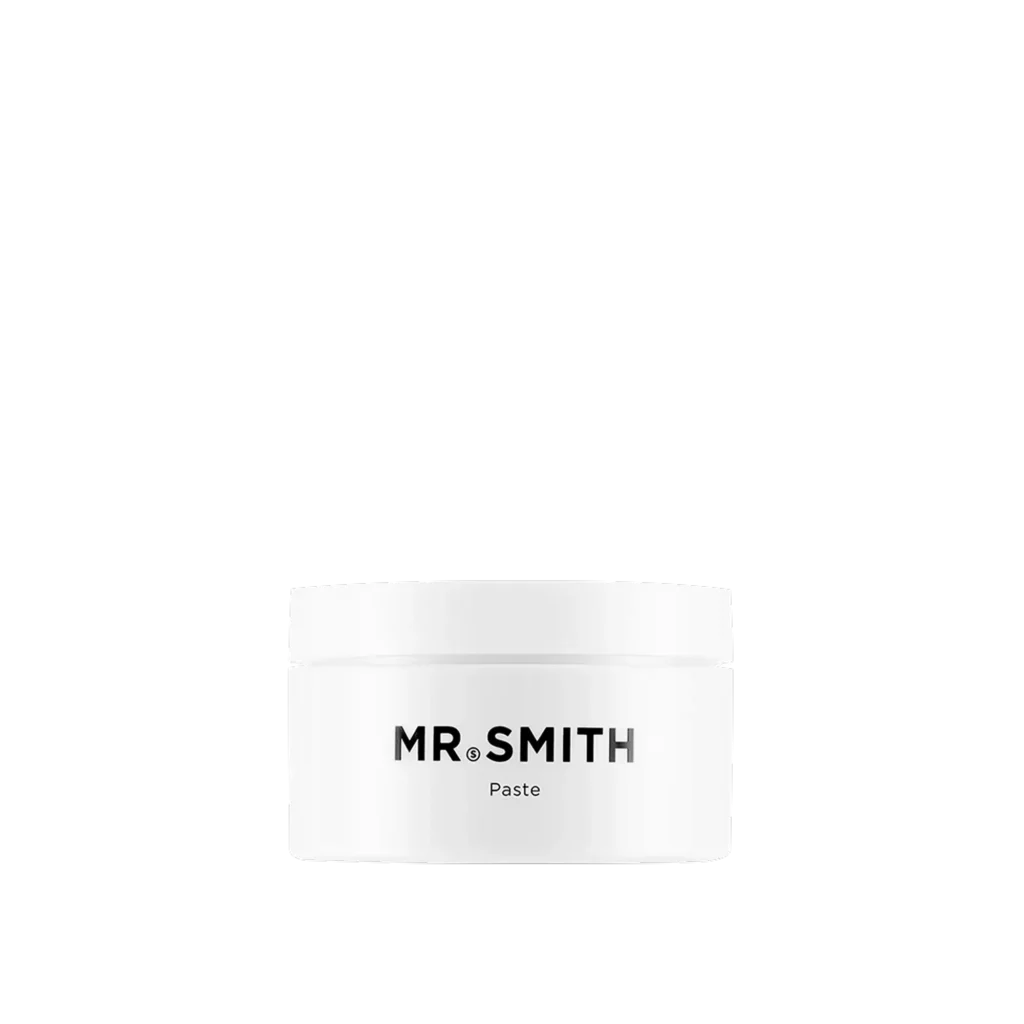 Witte pot Mr. Smith Paste haarstylingproduct met zwart logo op de voorkant.
