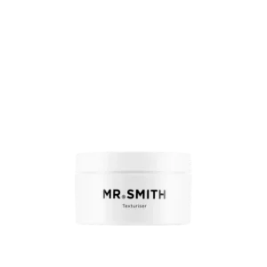 Witte pot Mr. Smith Texturiser haarproduct tegen een zwarte achtergrond.