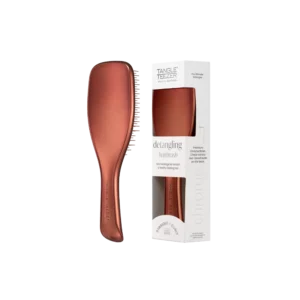 Bronzen Tangle Teezer ontklittingsborstel naast de bijbehorende verpakking.