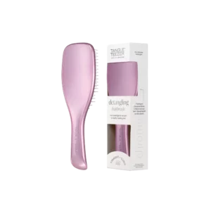 Lichtpaarse Tangle Teezer ontklittende haarborstel naast bijpassende verpakking in wit en transparant design.